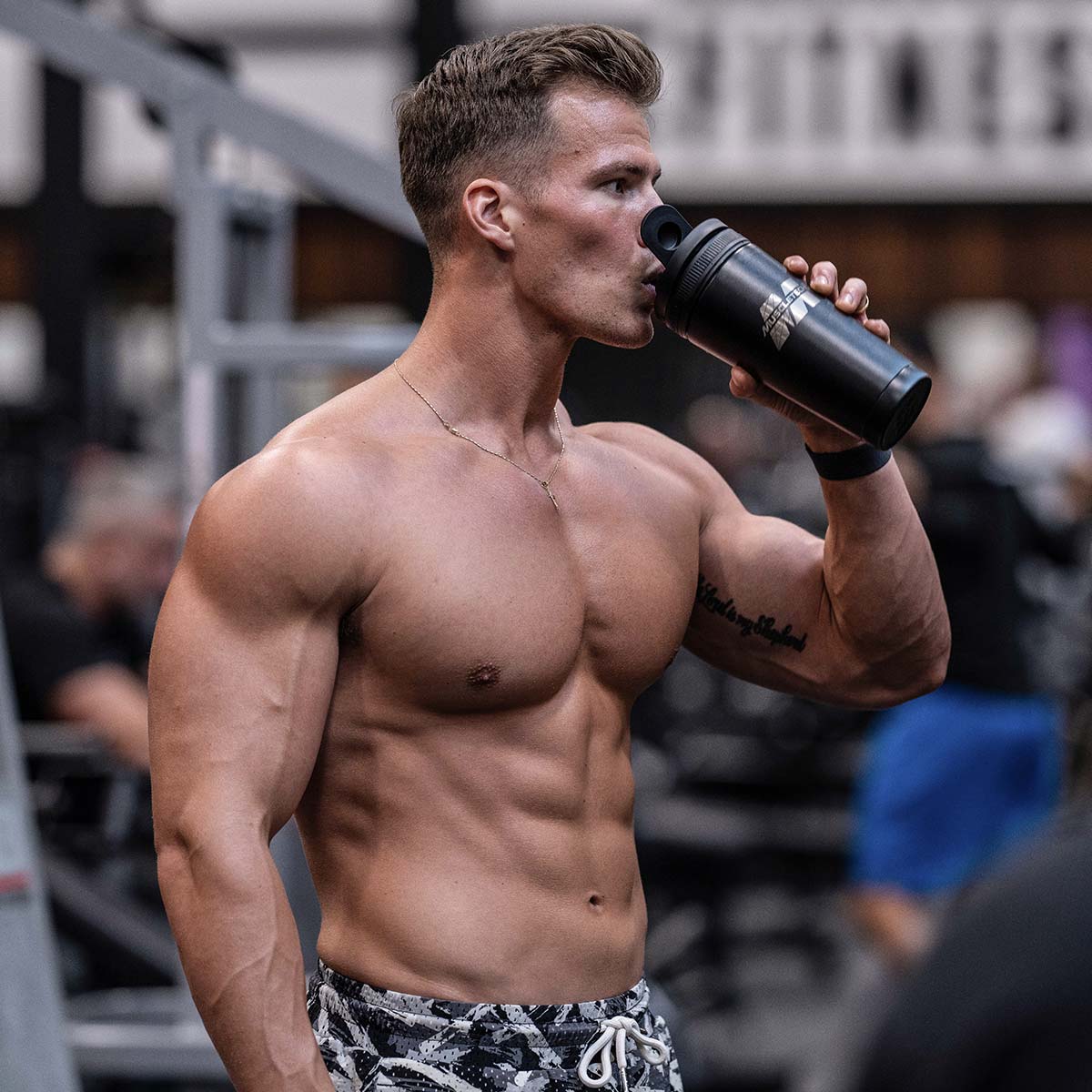 MuscleTech athlete drinking shake